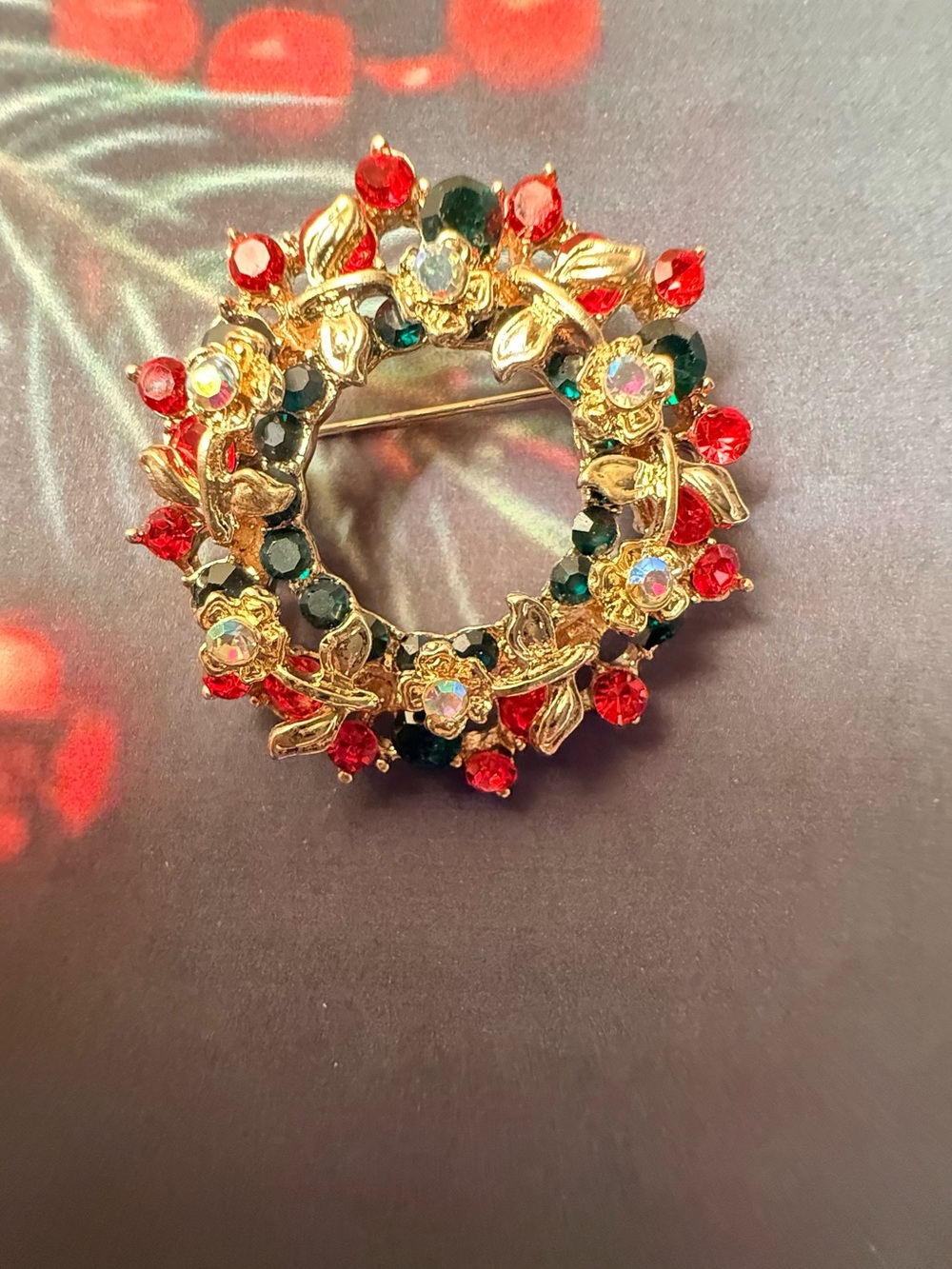 Gold Tone Holiday Wreath Brooch with Red and Green Crystals
